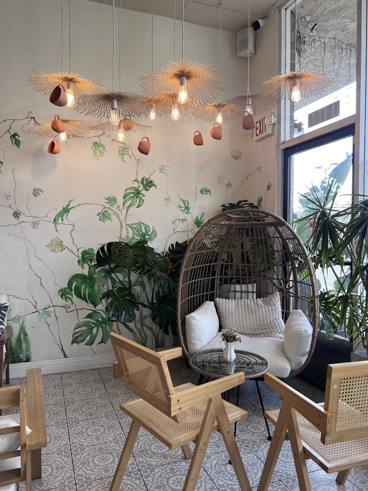 Cozy rattan chairs among the plants