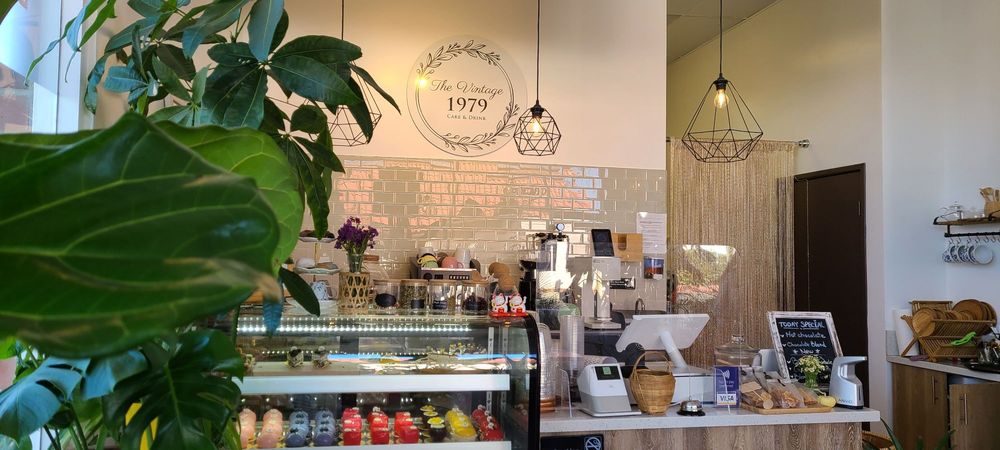 Inside The Vintage 1979: the counter, brick wall, and dessert case